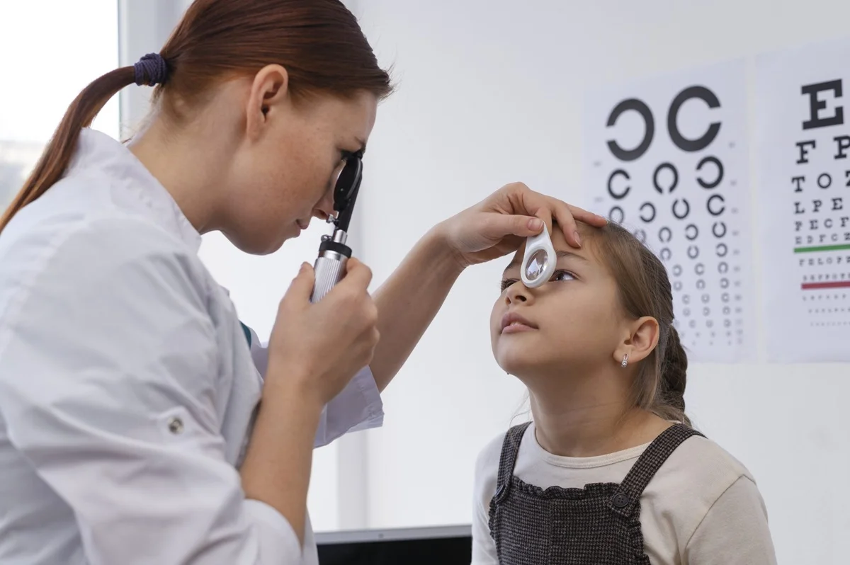 doctors testing eye sight of a child for low vision