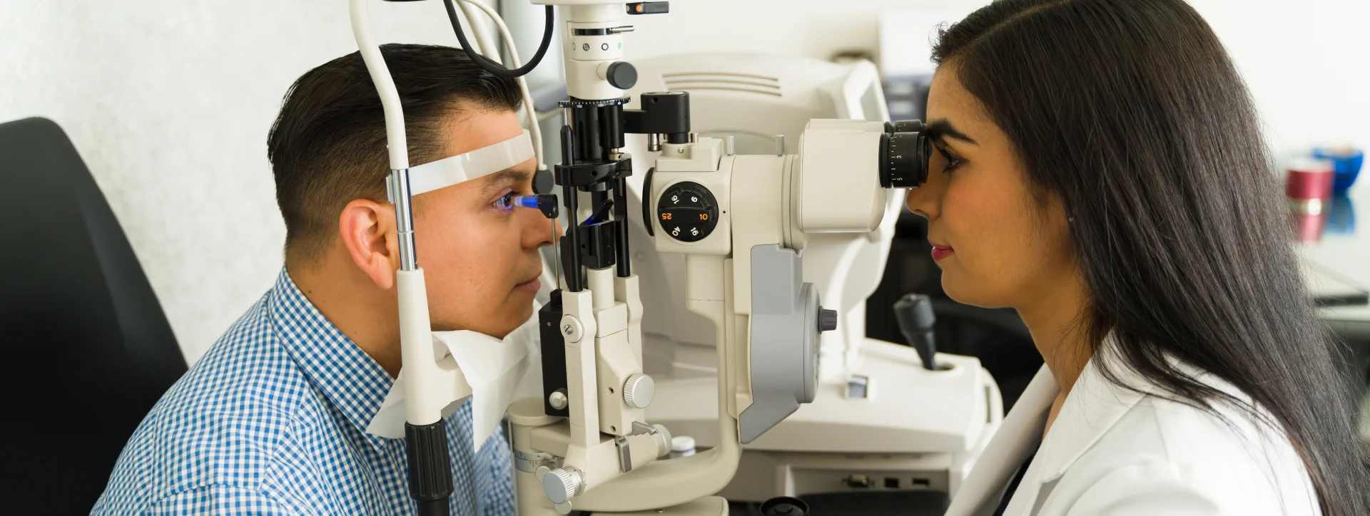 observing the eye of a patient by a specialist