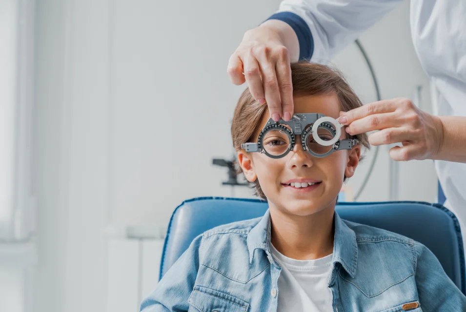 testing vision of a boy by a eye specialist