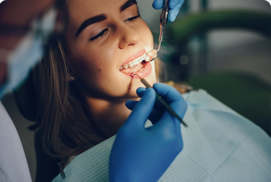 Vasan eye hospital - A dentist examining a patient's teeth